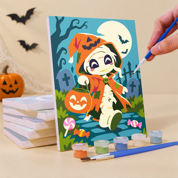Pintando uno de los mini lienzos de Personajes de Feria Nocturna con un pincel fino